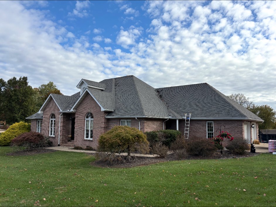 Completed roofing project with fresh shingles
